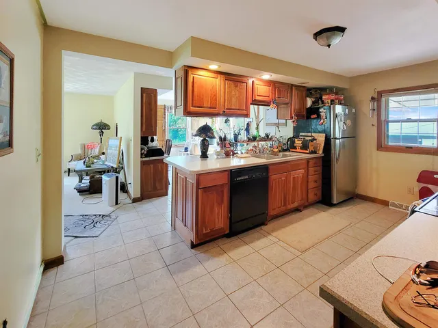 a kitchen with a sink and a stove top oven