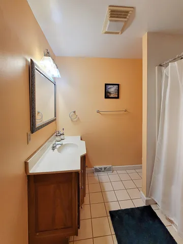 a white toilet sitting next to a small sink