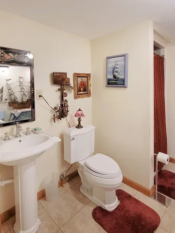 a view of a wooden bench in backyard