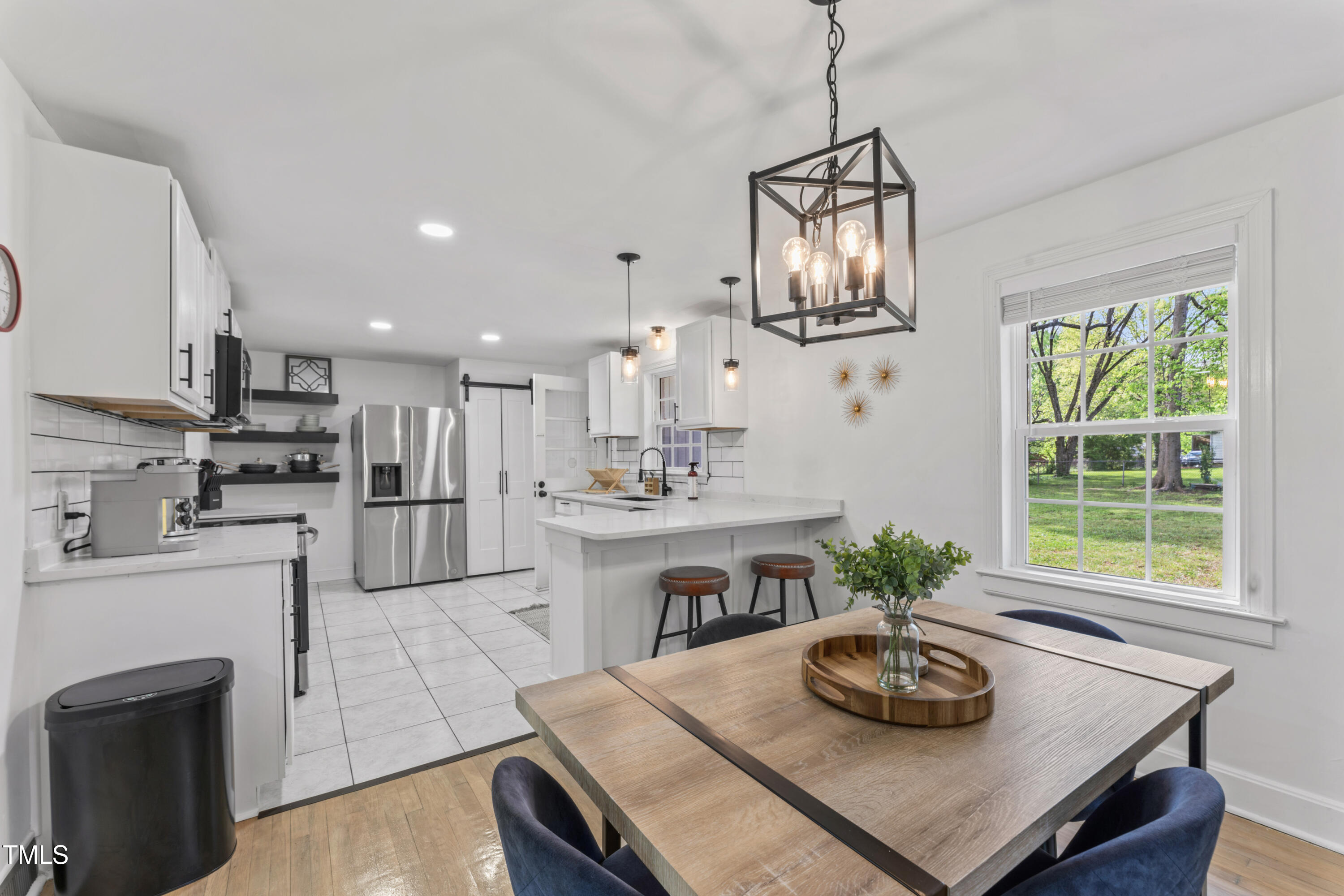 711 Horton Road Durham, NC 27704 - Photo 11 of 28 a kitchen with furniture and a window