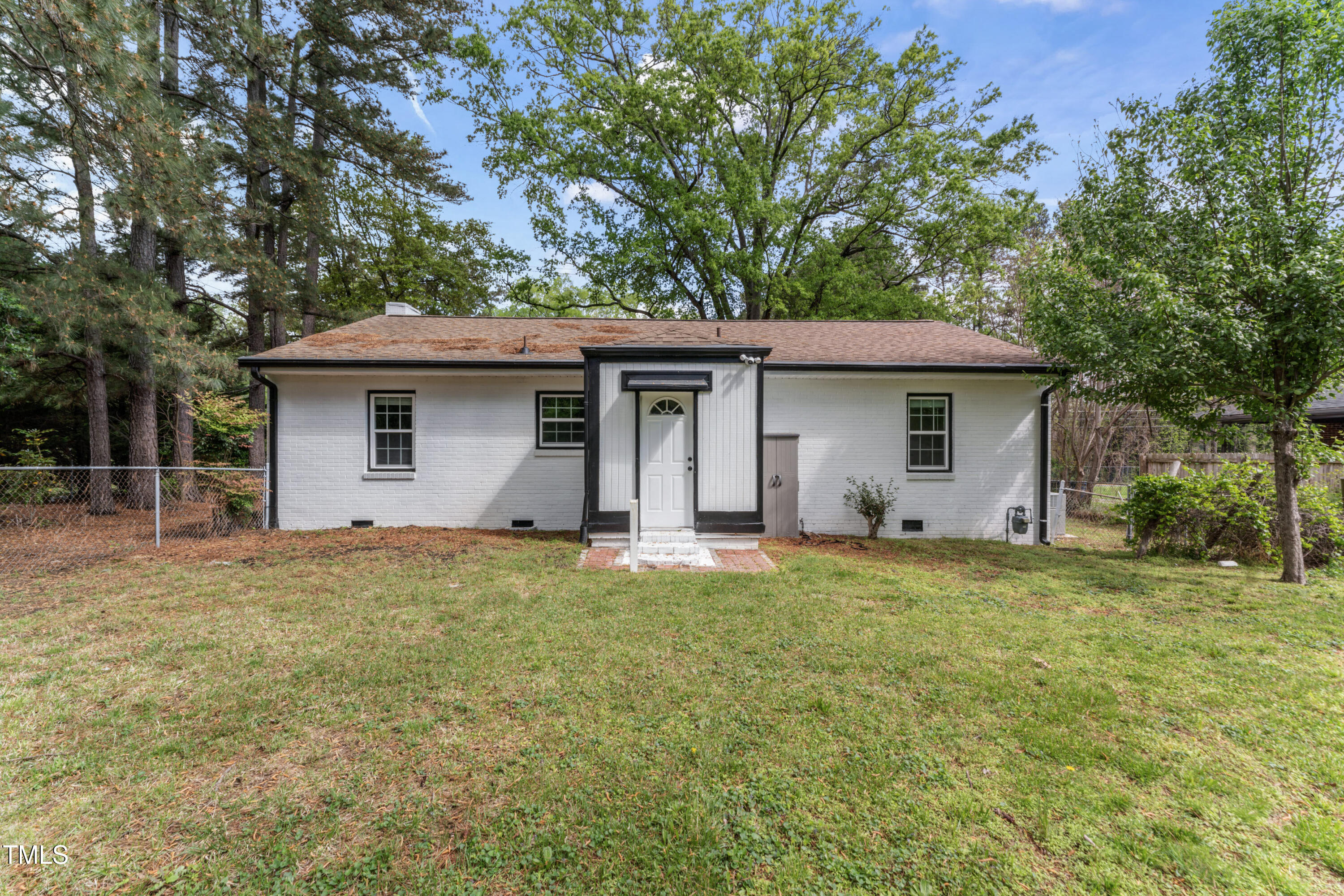 711 Horton Road Durham, NC 27704 - Photo 23 of 28 a backyard of a house with yard and outdoor seating