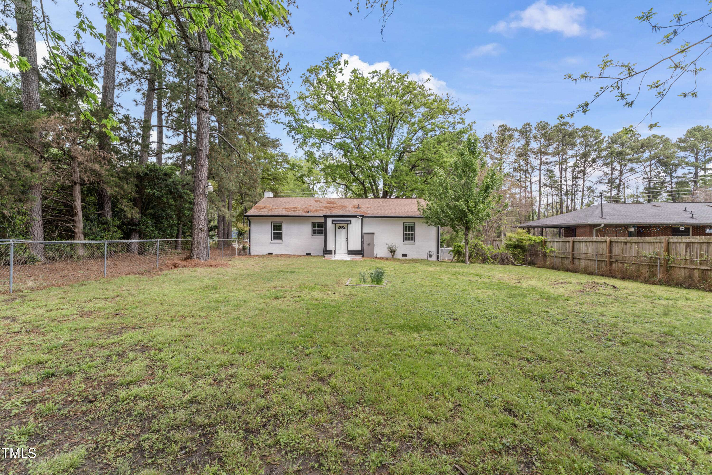 711 Horton Road Durham, NC 27704 - Photo 24 of 28 a front view of a house with a garden