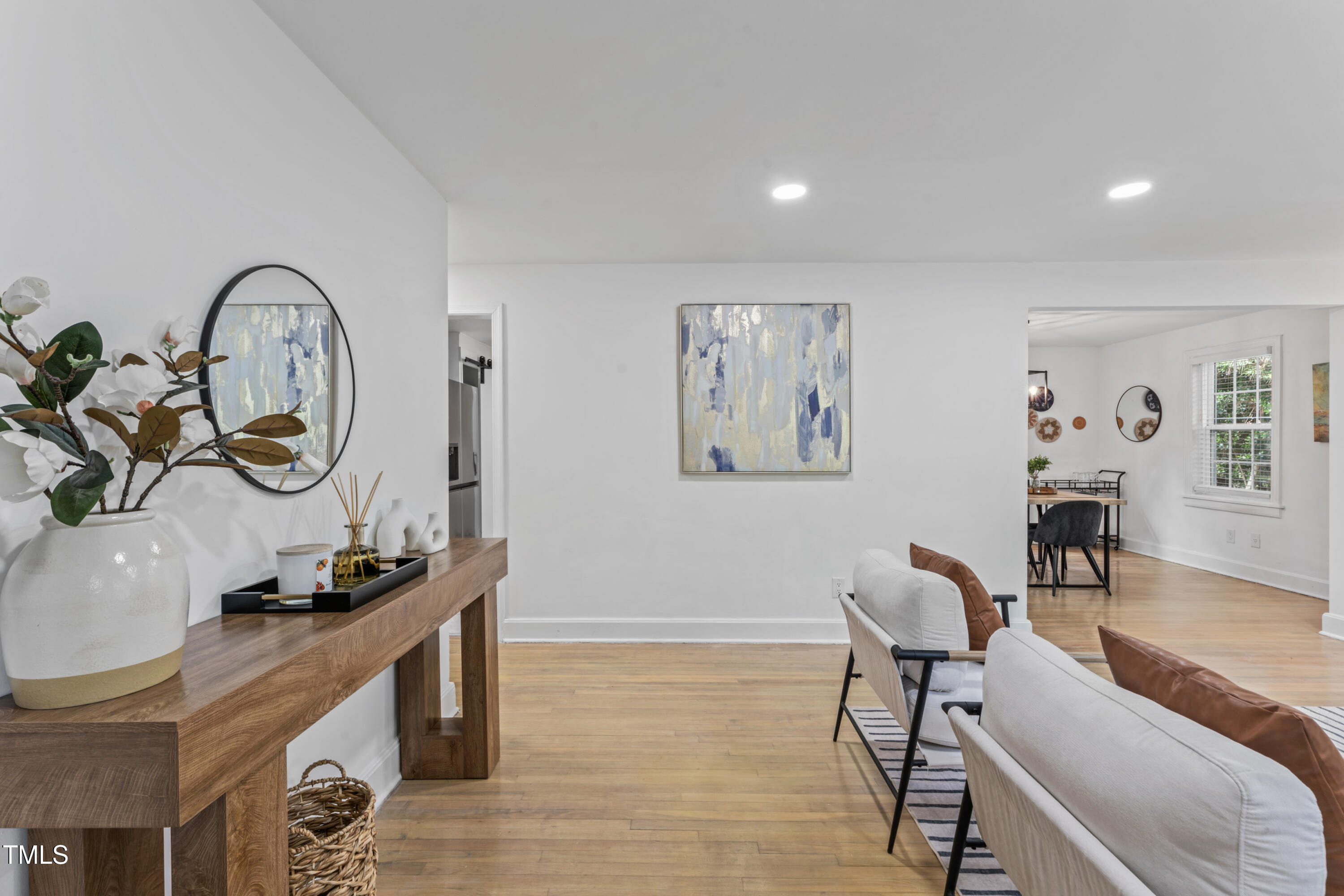 711 Horton Road Durham, NC 27704 - Photo 5 of 28 a living room with furniture and a wooden floor