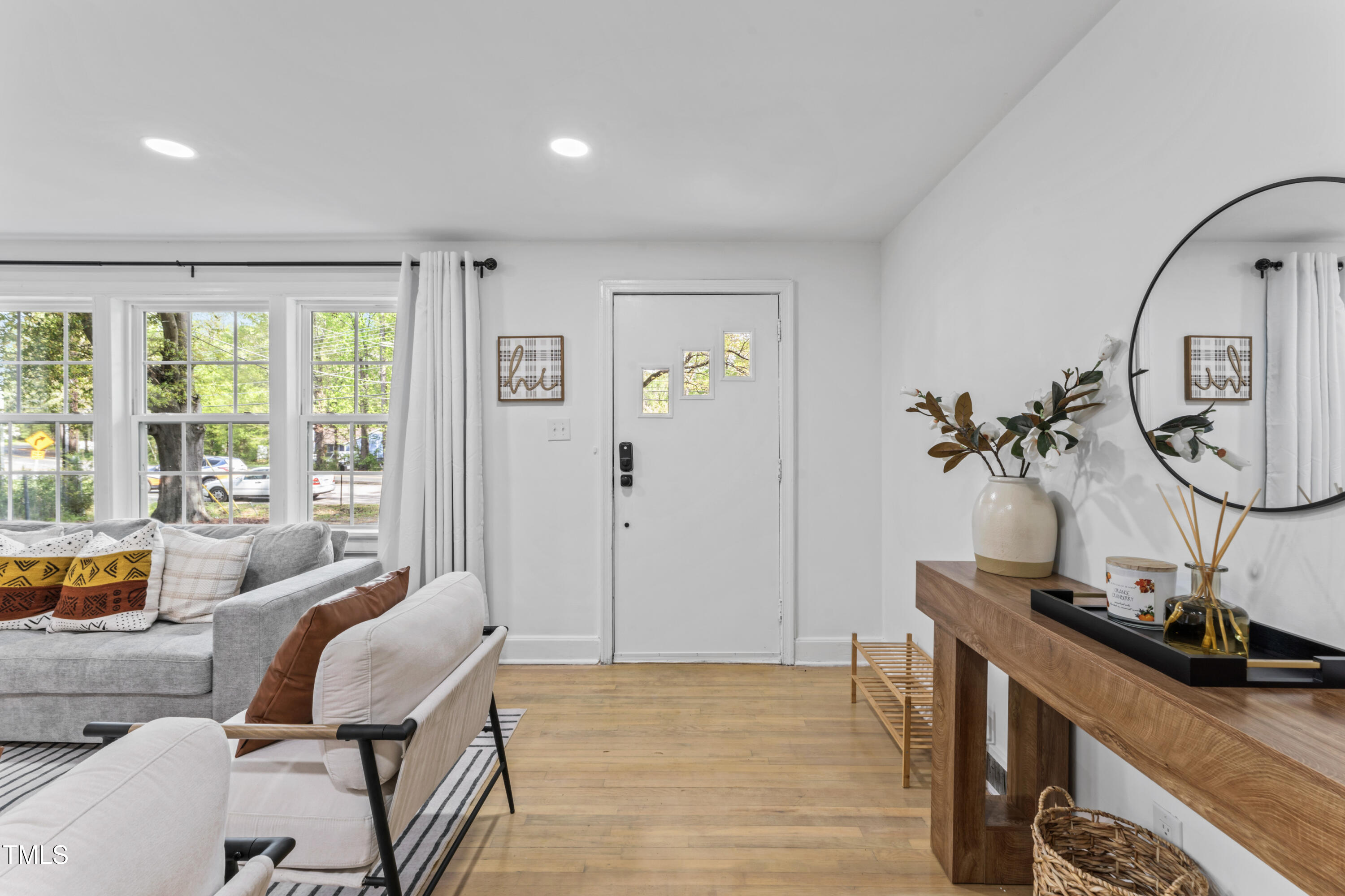 711 Horton Road Durham, NC 27704 - Photo 7 of 28 a workspace with wooden floor and windows