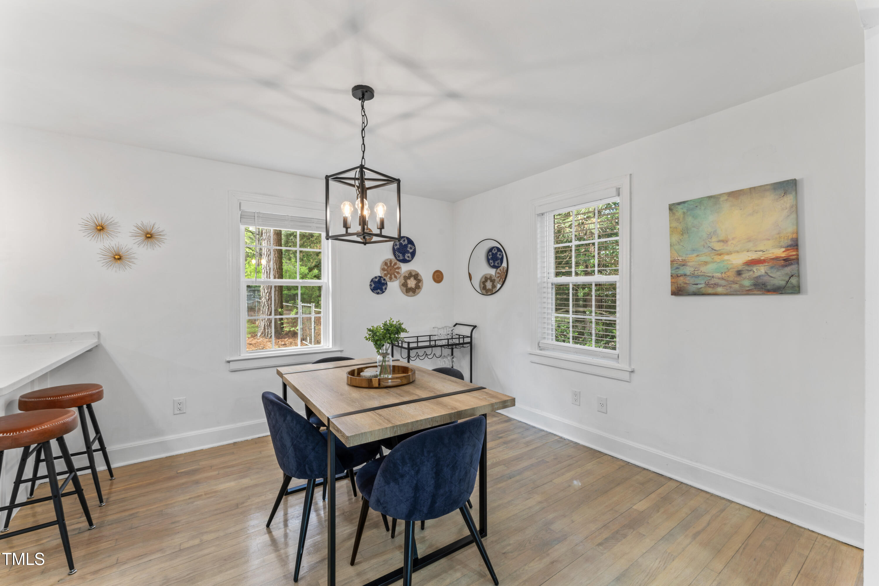 711 Horton Road Durham, NC 27704 - Photo 10 of 28 a view of a dining room with furniture window and wooden floor