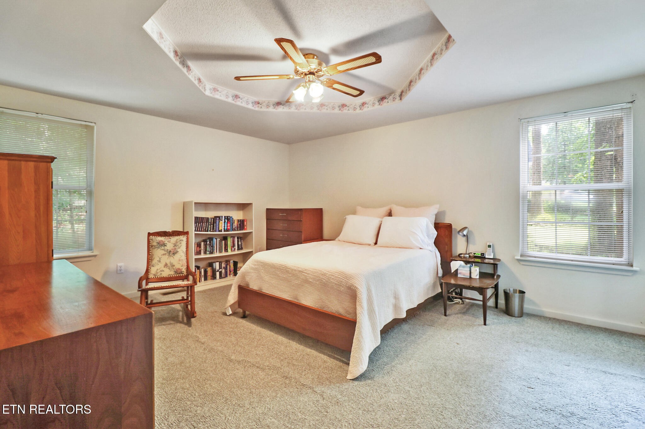 101 Ashdown Lane Crossville, TN 38558 - Photo 24 of 34 a bedroom with a bed and dresser with wooden floor