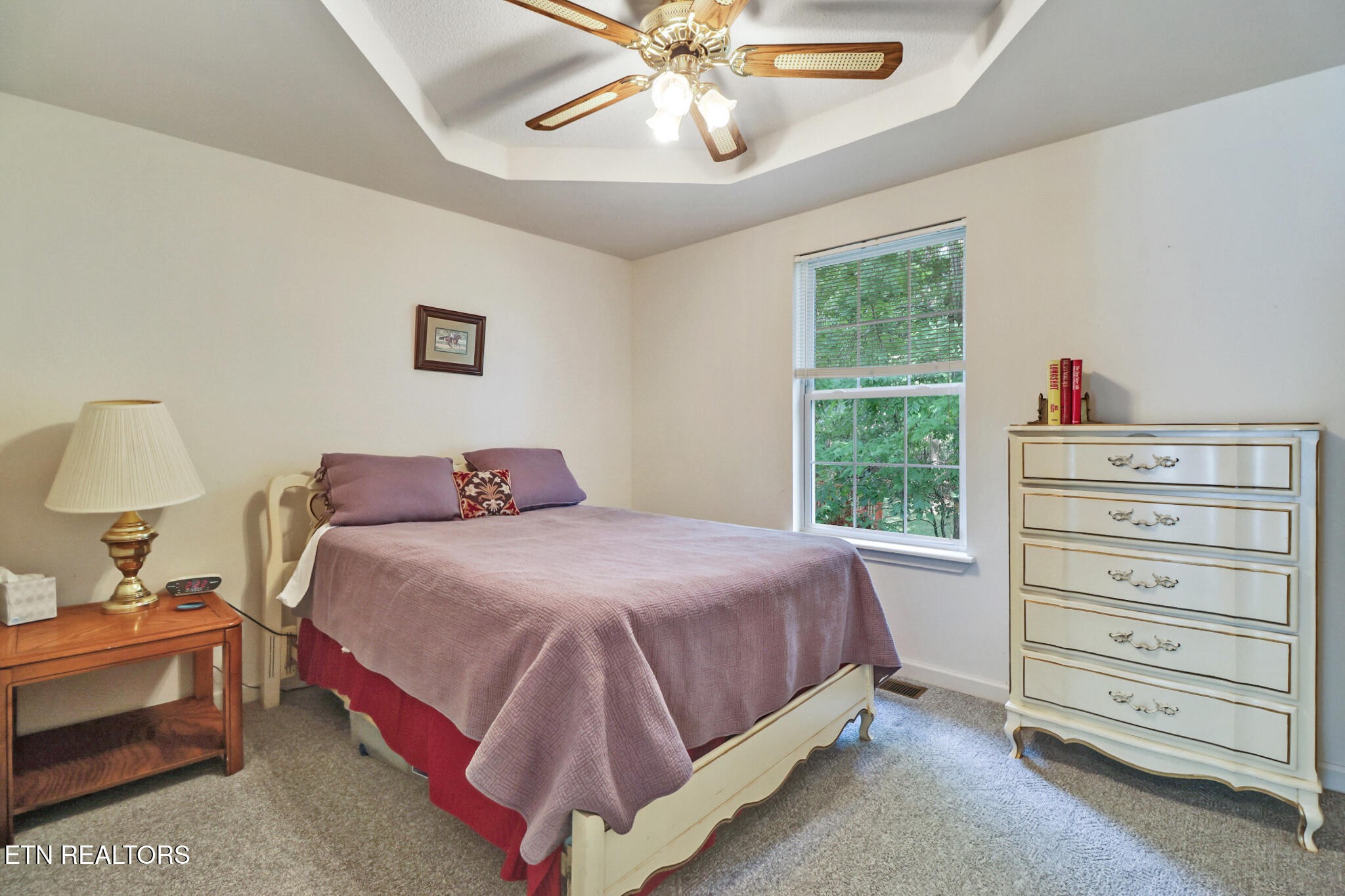 101 Ashdown Lane Crossville, TN 38558 - Photo 30 of 34 a bedroom with a bed and a chandelier