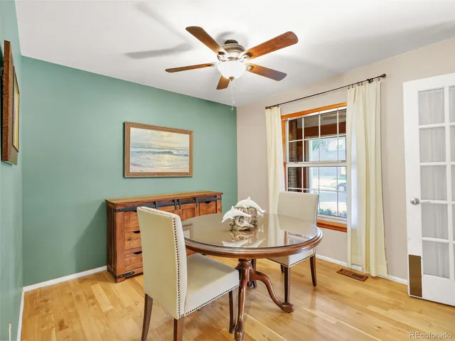 a dining room with furniture and window