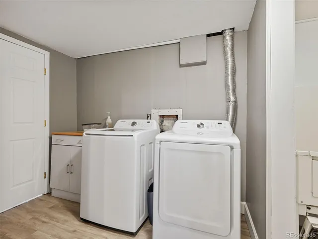 a bathroom with a sink mirror and toilet