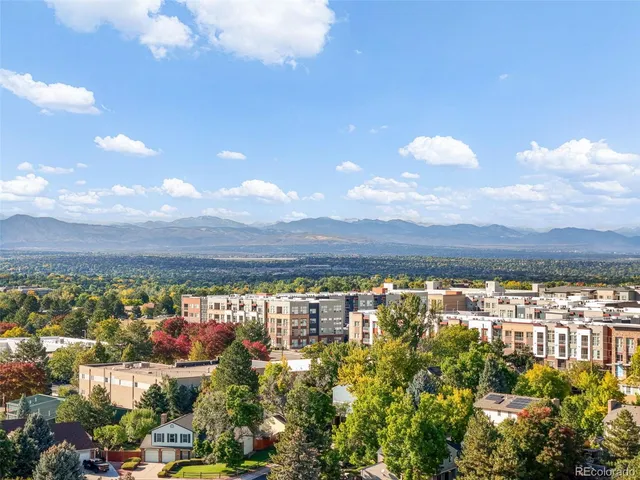 an aerial view of multiple houses with yard