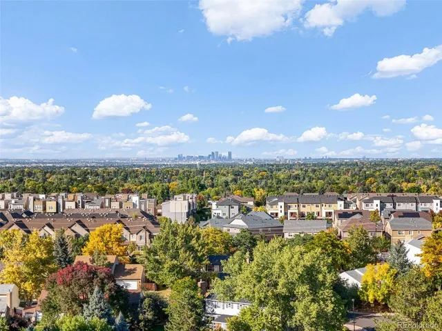 an aerial view of a house with a garden and a yard