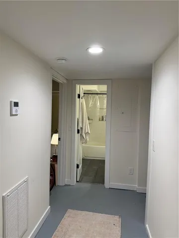 an empty room with mirror in it