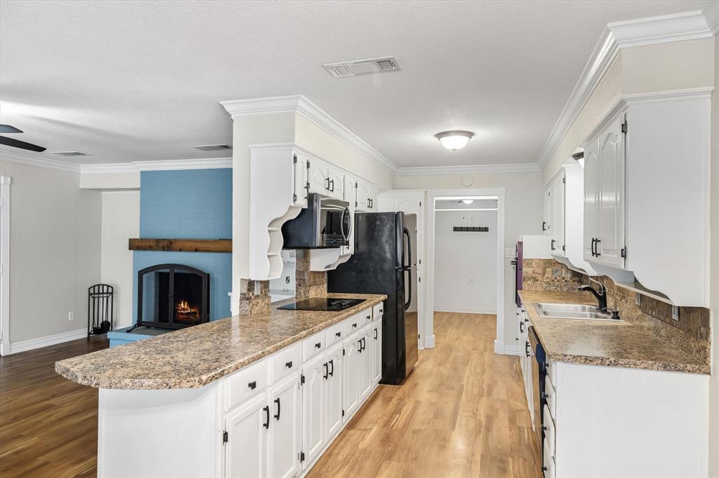 913 Pinson Road Forney, TX 75126 - Photo 6 of 19 Kitchen opens to the two living rooms.