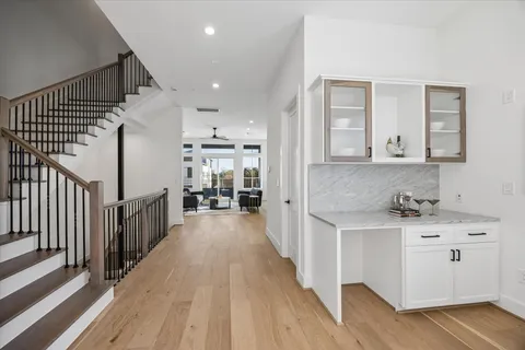 a kitchen with cabinets a sink and wooden floor