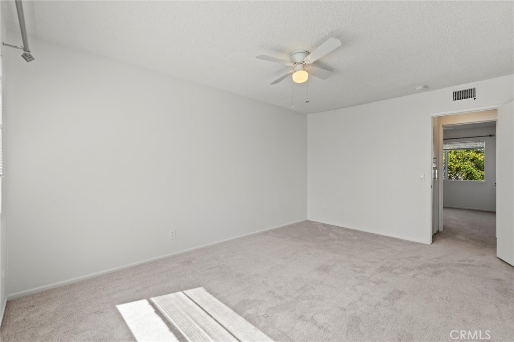 19041 Hamlin Street, Unit 5 Reseda, CA 91335 - Photo 13 of 25 Primary Bedroom with view of Hallway