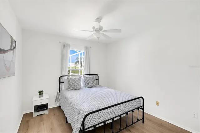 a view of a bedroom with a bed and cabinet