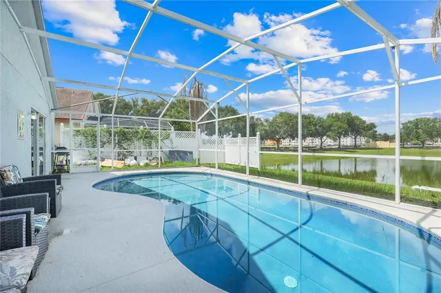 a view of a backyard with a swimming pool