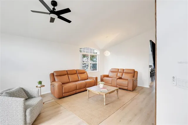 a living room with furniture and a window
