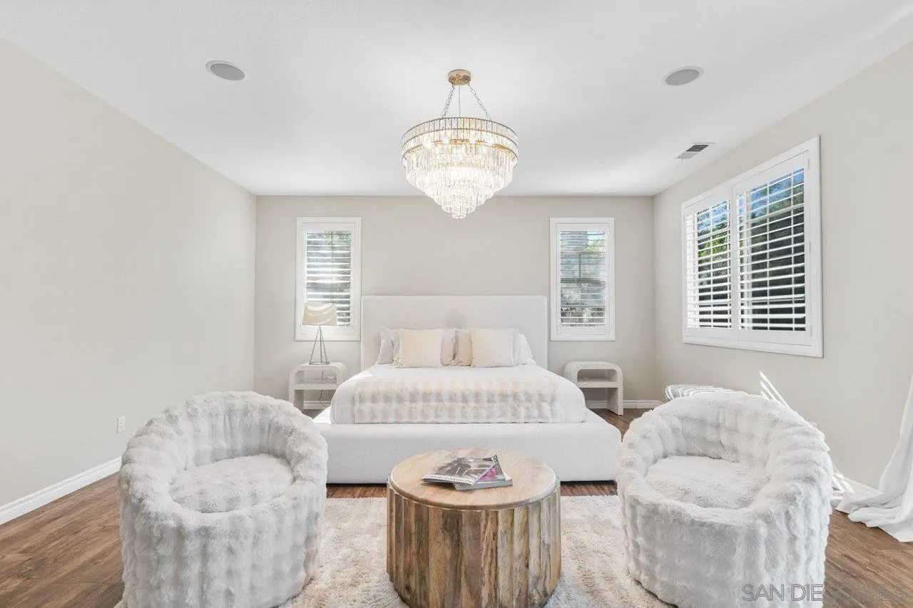 2957 Ranch Gate Road Chula Vista, CA 91914 - Photo 36 of 75 a bedroom with a bed and a chandelier