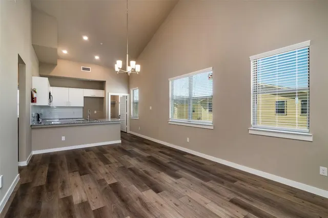 a kitchen with stainless steel appliances a sink stove and refrigerator