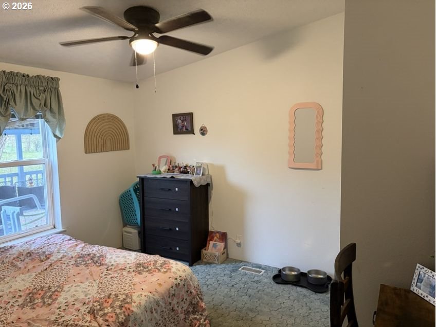 503 Old Pioneer Road Sutherlin, OR 97479 - Photo 11 of 48 a bedroom with a bed and a dresser