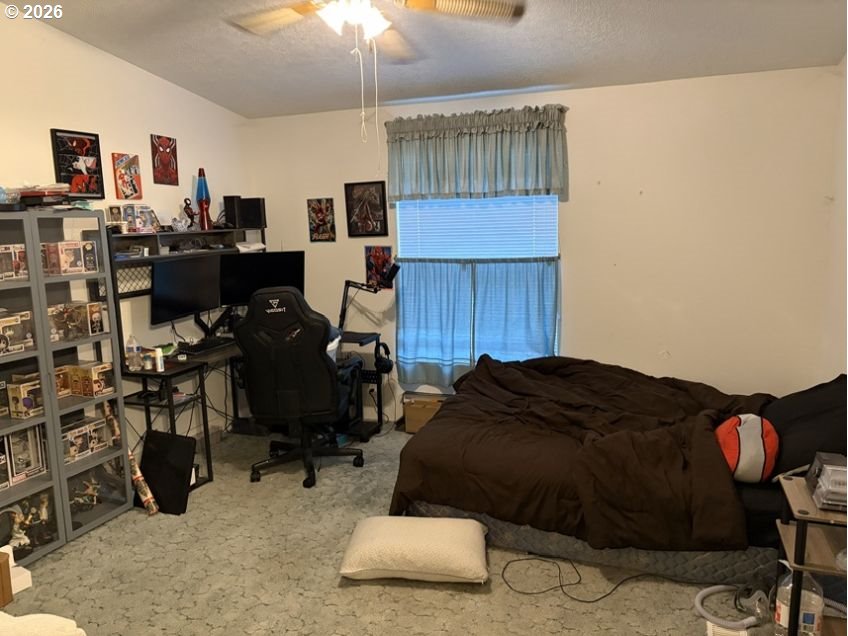 503 Old Pioneer Road Sutherlin, OR 97479 - Photo 13 of 48 a bedroom with bed and a window