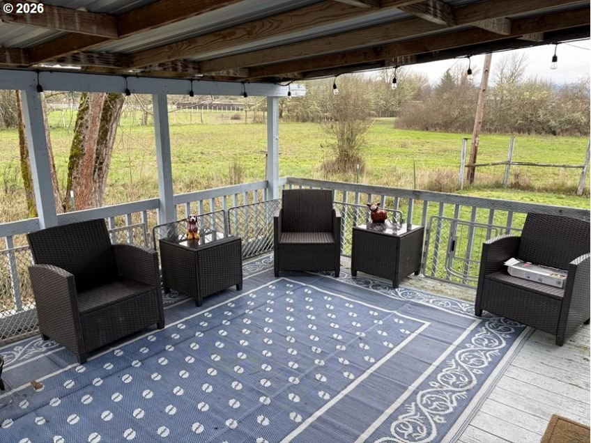 503 Old Pioneer Road Sutherlin, OR 97479 - Photo 17 of 48 a living room with furniture and a floor to ceiling window