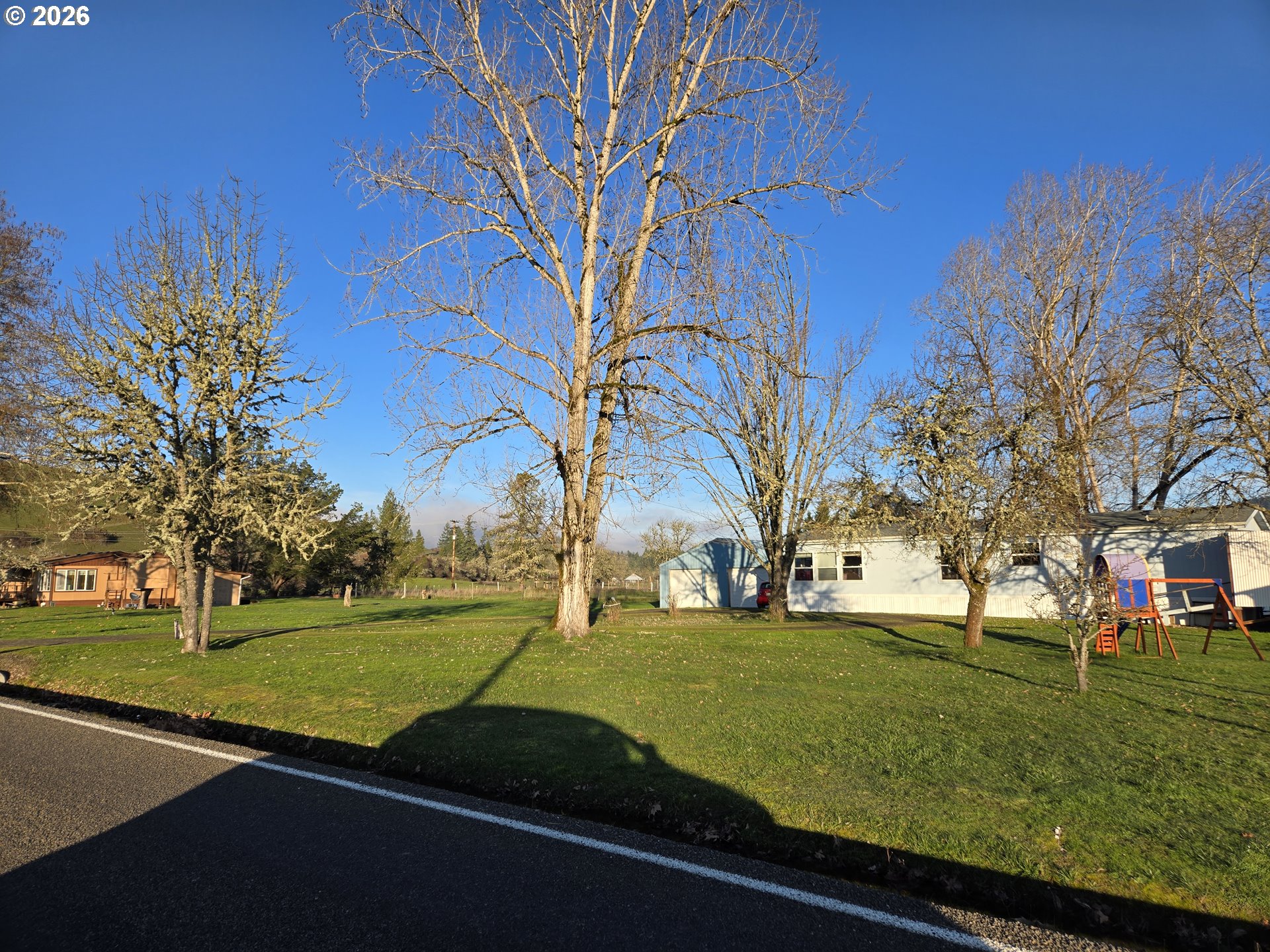 503 Old Pioneer Road Sutherlin, OR 97479 - Photo 2 of 48 a view of a park with large trees