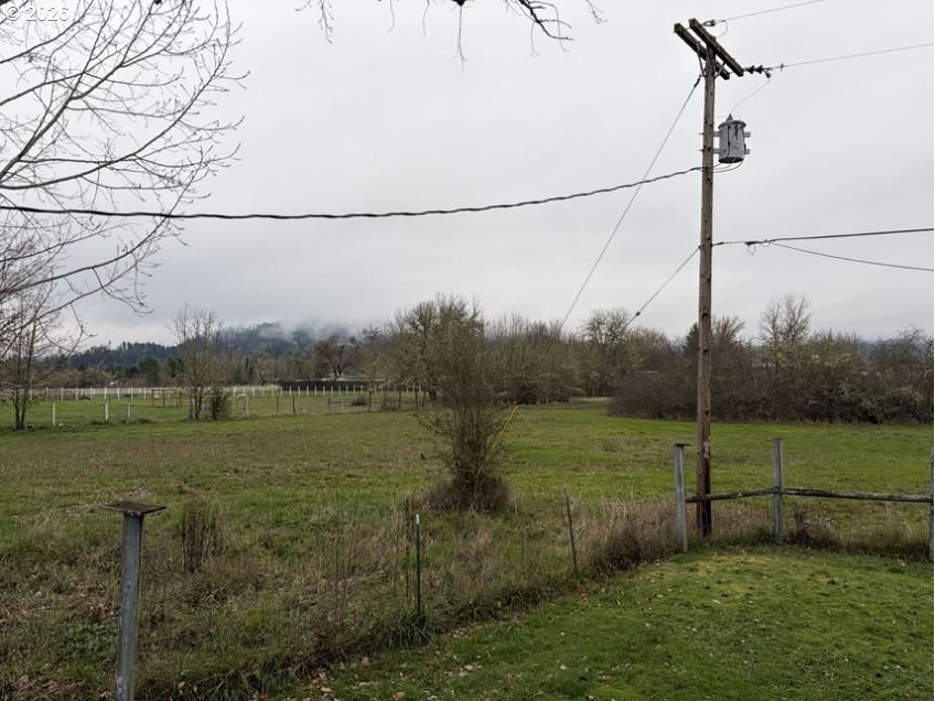 503 Old Pioneer Road Sutherlin, OR 97479 - Photo 28 of 48 a view of a field with a tree in the background