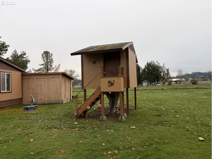 503 Old Pioneer Road Sutherlin, OR 97479 - Photo 36 of 48 a view of a tiny house with a yard