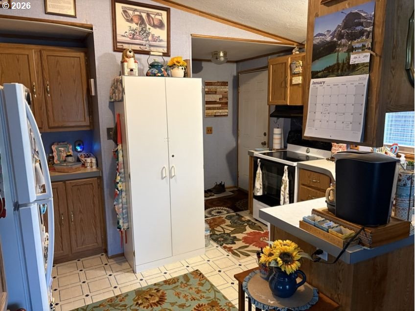 503 Old Pioneer Road Sutherlin, OR 97479 - Photo 37 of 48 a refrigerator freezer sitting inside of a kitchen