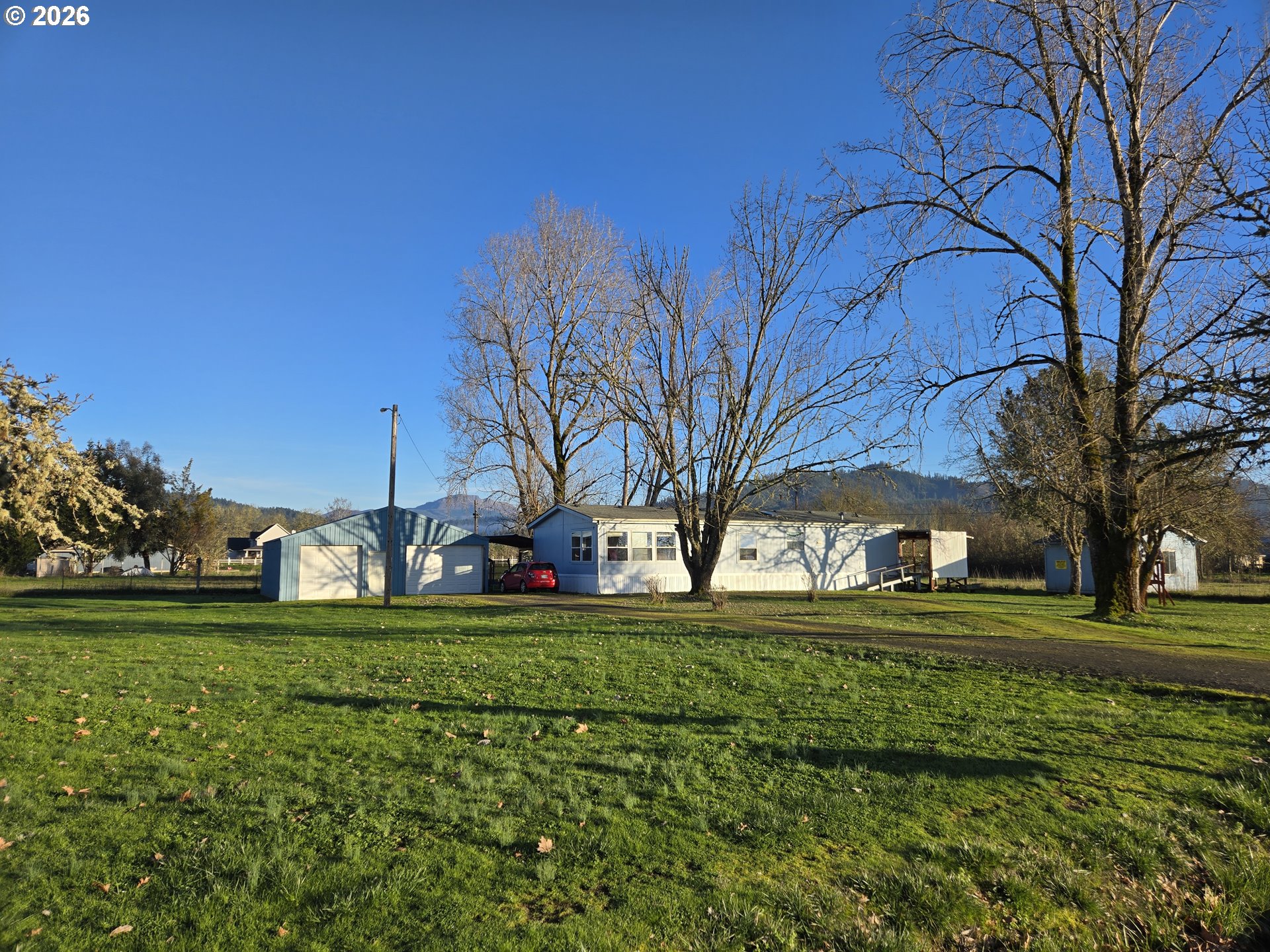 503 Old Pioneer Road Sutherlin, OR 97479 - Photo 4 of 48 a view of a park with large trees