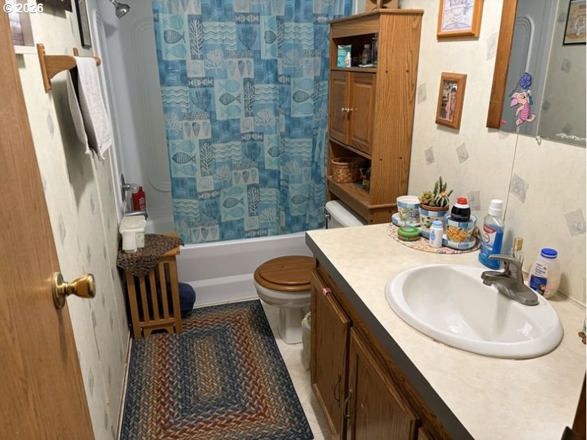503 Old Pioneer Road Sutherlin, OR 97479 - Photo 42 of 48 a bathroom with a sink a toilet a mirror and shower