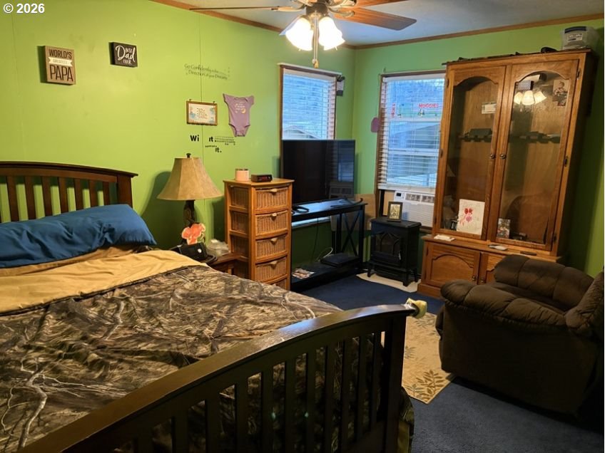 503 Old Pioneer Road Sutherlin, OR 97479 - Photo 43 of 48 a bedroom with a bed and a flat screen tv