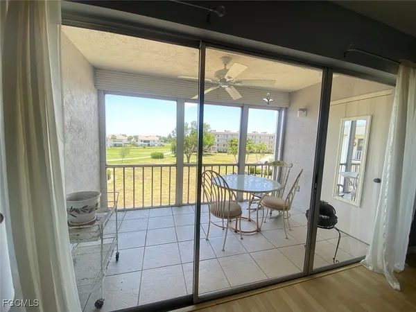 a view of a room with balcony and furniture