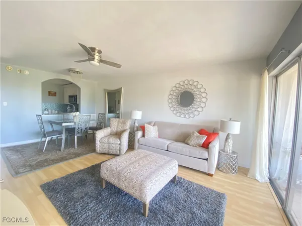 a living room with furniture and a rug