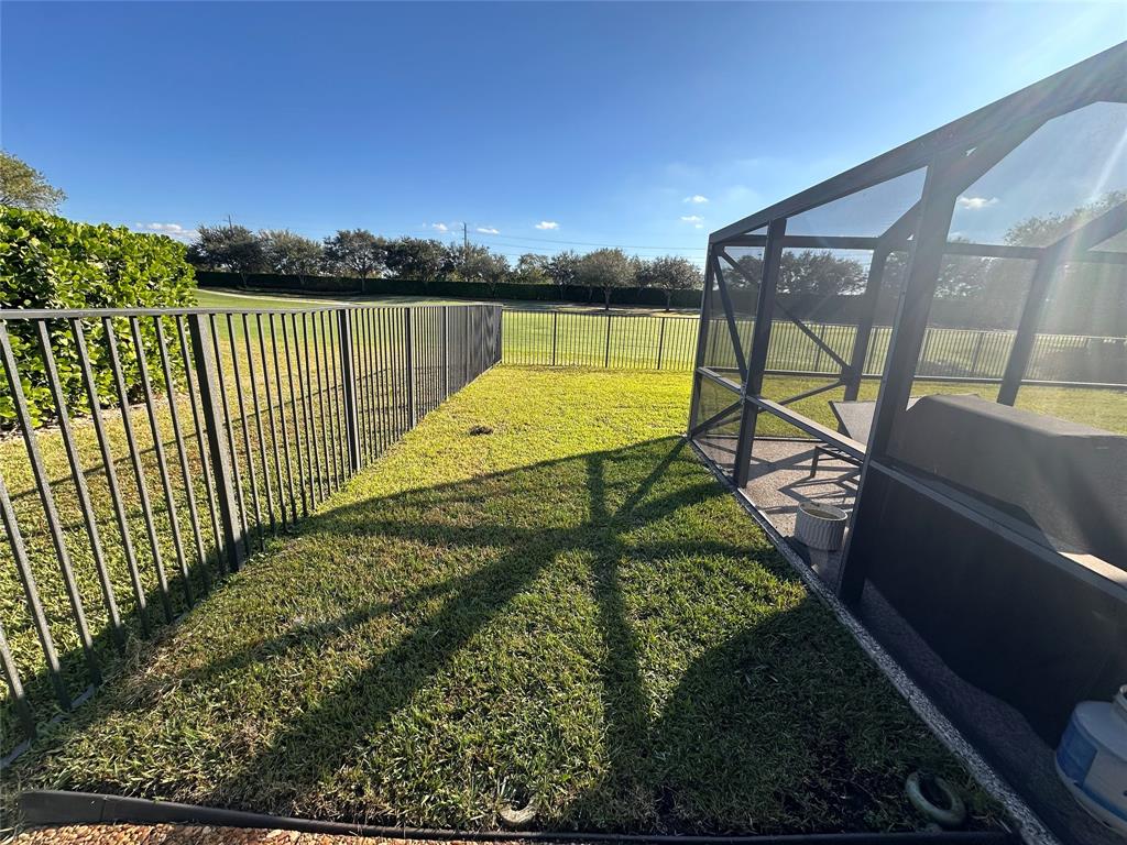 11392 Boca Woods Lane Boca Raton, FL 33428 - Photo 11 of 26 a view of a swimming pool with a garden and deck