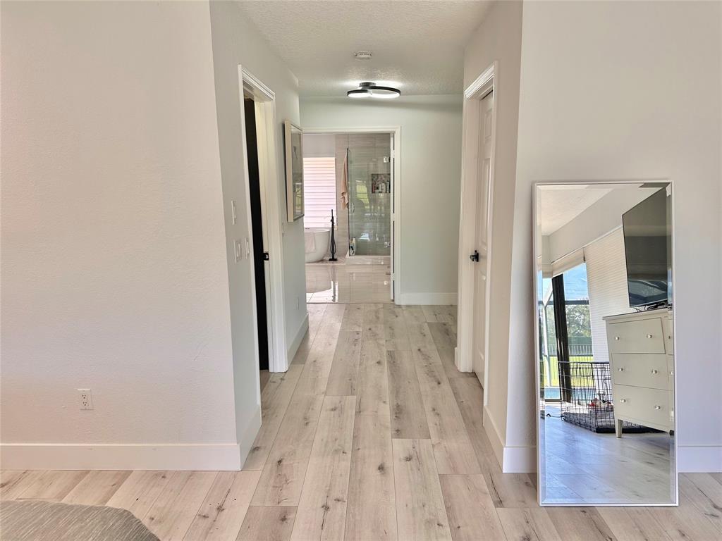 11392 Boca Woods Lane Boca Raton, FL 33428 - Photo 13 of 26 wooden floor in a gallery