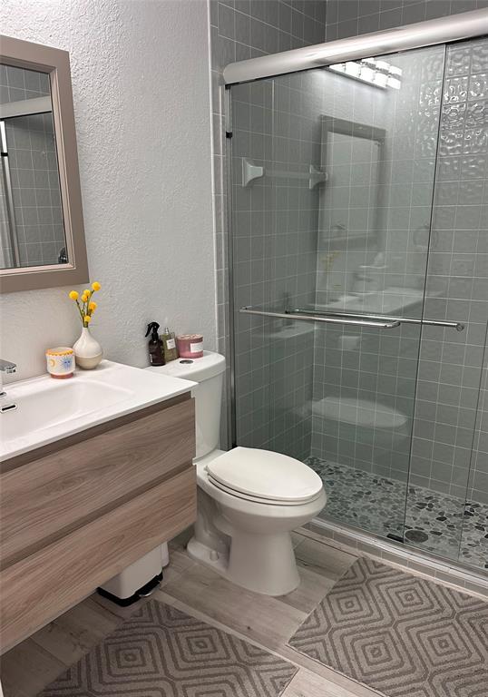 11392 Boca Woods Lane Boca Raton, FL 33428 - Photo 18 of 26 a bathroom with a sink toilet and shower