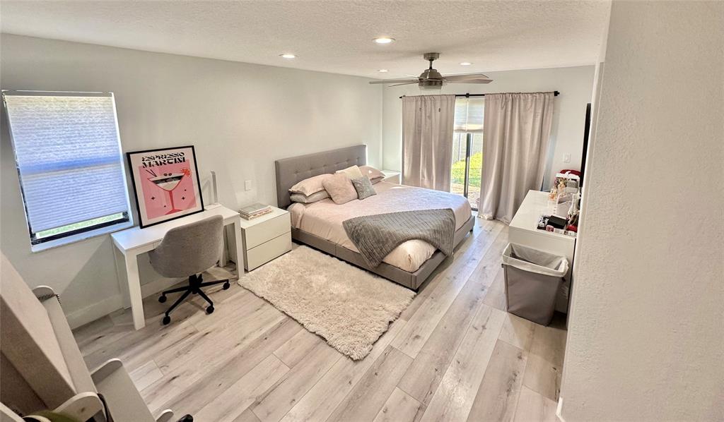 11392 Boca Woods Lane Boca Raton, FL 33428 - Photo 19 of 26 a living room with furniture and a window