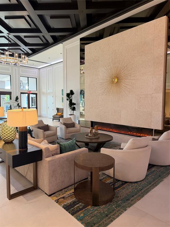 11392 Boca Woods Lane Boca Raton, FL 33428 - Photo 25 of 26 a living room with furniture and a table