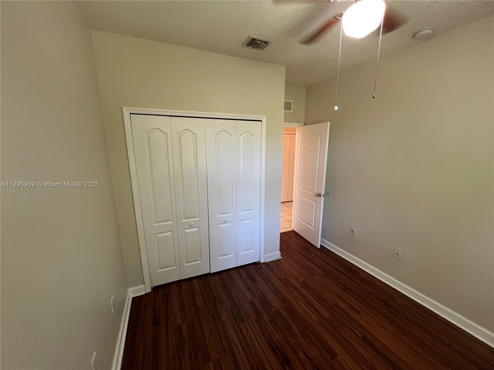 2903 Southeast 17th Avenue, Unit 201 Homestead, FL 33035 - Photo 19 of 42 an empty room with wooden floor