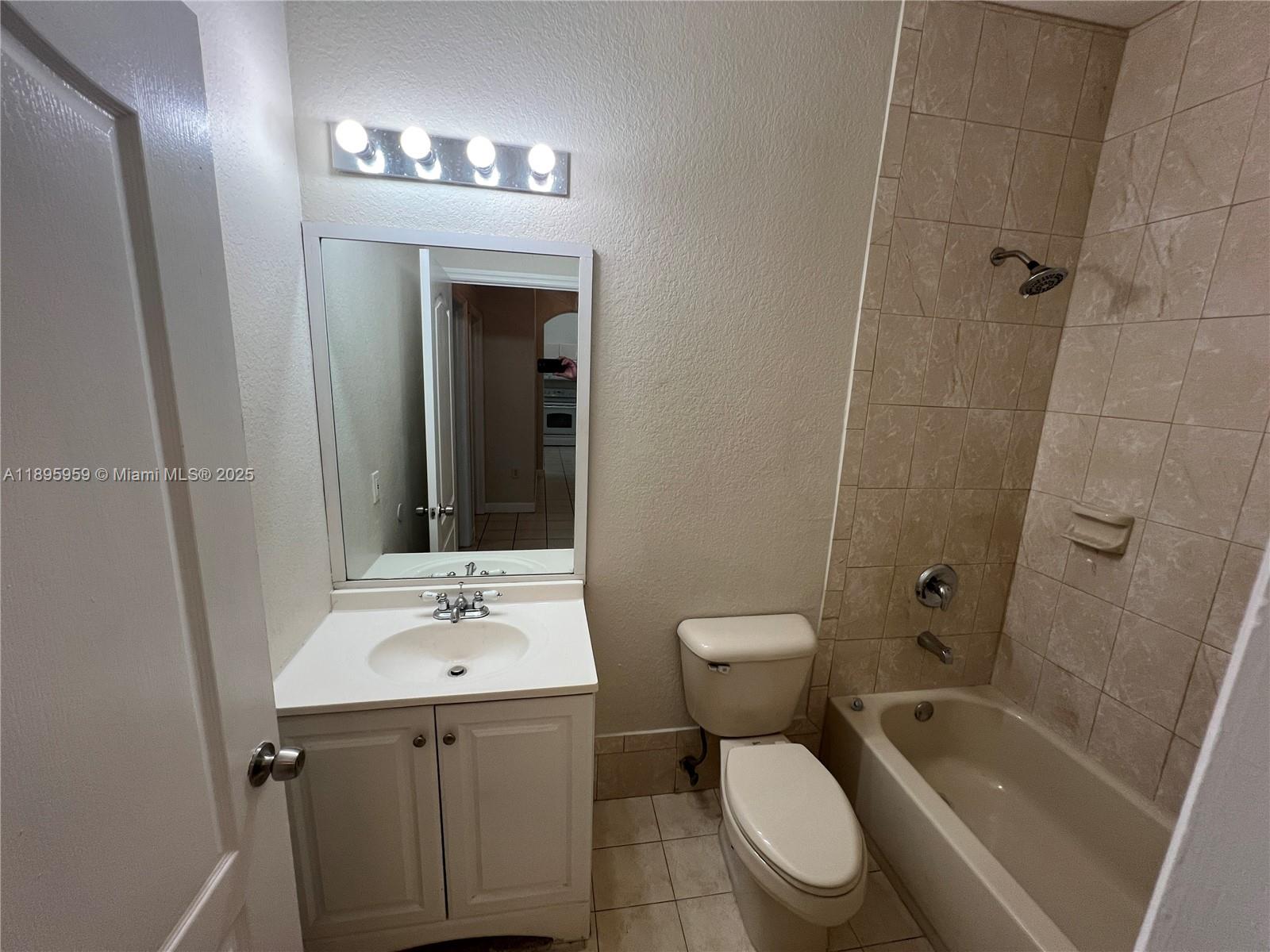 2903 Southeast 17th Avenue, Unit 201 Homestead, FL 33035 - Photo 23 of 42 a bathroom with a sink toilet and shower