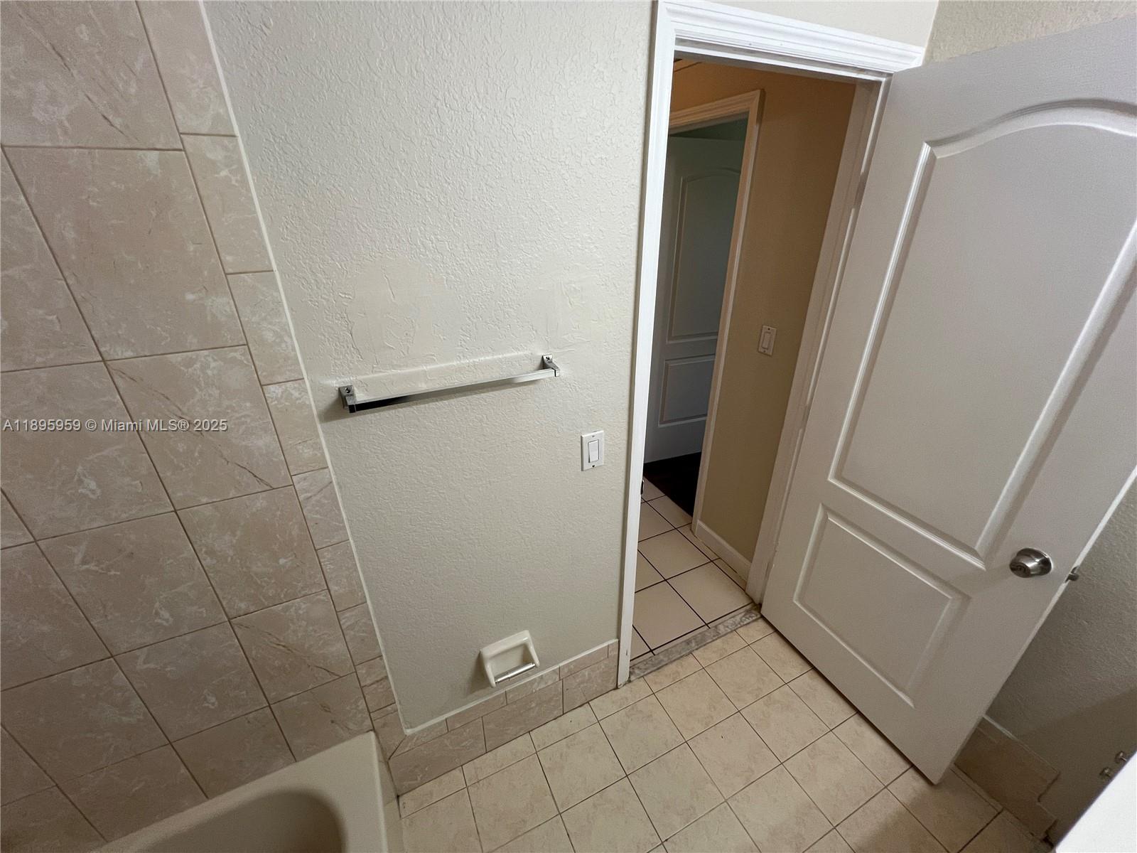 2903 Southeast 17th Avenue, Unit 201 Homestead, FL 33035 - Photo 26 of 42 a bathroom with a shower and toilet