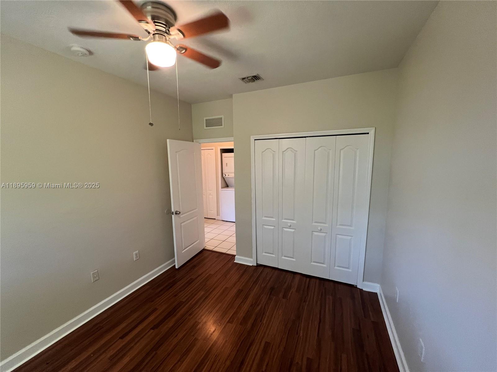 2903 Southeast 17th Avenue, Unit 201 Homestead, FL 33035 - Photo 27 of 42 wooden floor in an empty room with a window