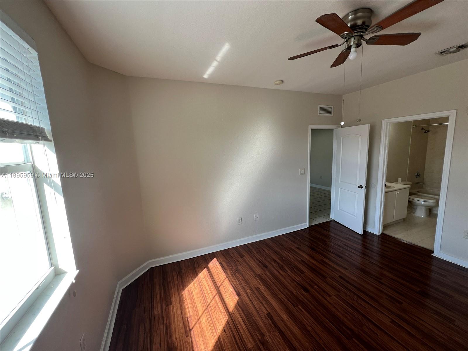 2903 Southeast 17th Avenue, Unit 201 Homestead, FL 33035 - Photo 38 of 42 a view of an empty room and window
