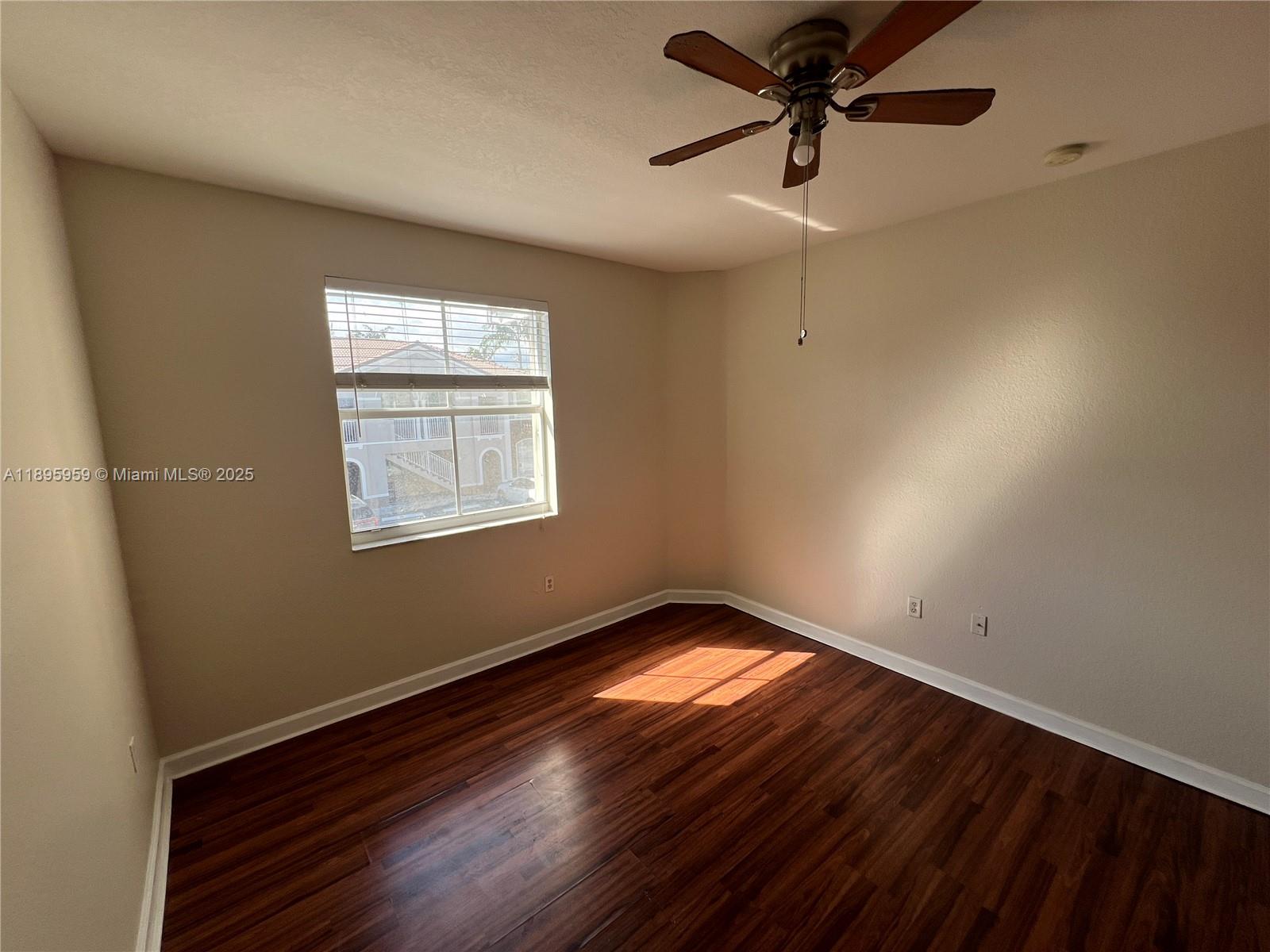 2903 Southeast 17th Avenue, Unit 201 Homestead, FL 33035 - Photo 40 of 42 a view of an empty room and window