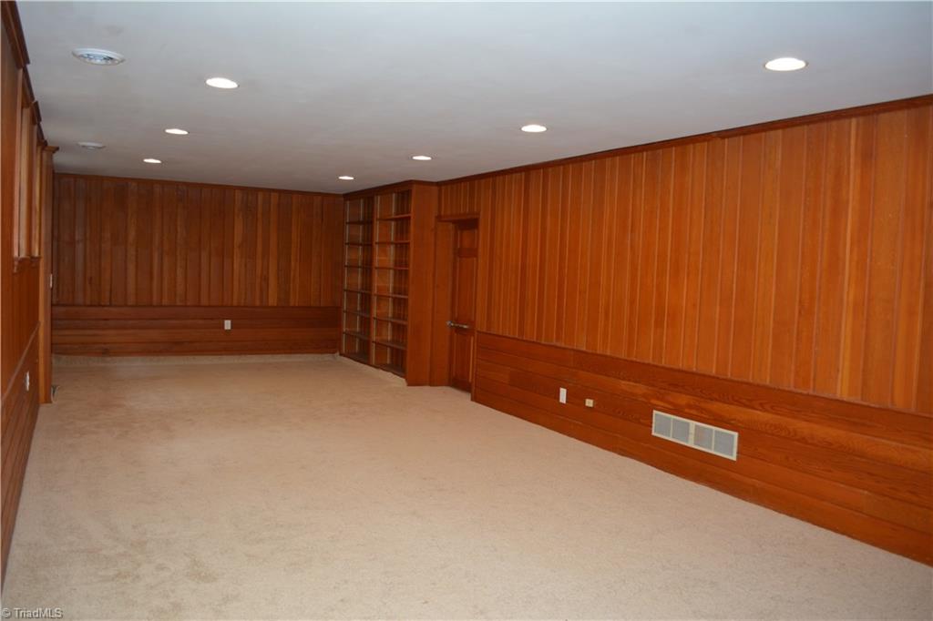 3350 Kirklees Road Winston-Salem, NC 27104 - Photo 16 of 21 Large bonus area in basement with built-ins and fireplace