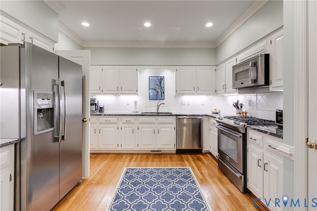 498 St Albans Way Henrico, VA 23229 - Photo 11 of 46 a kitchen with stainless steel appliances granite countertop a refrigerator and a stove top oven