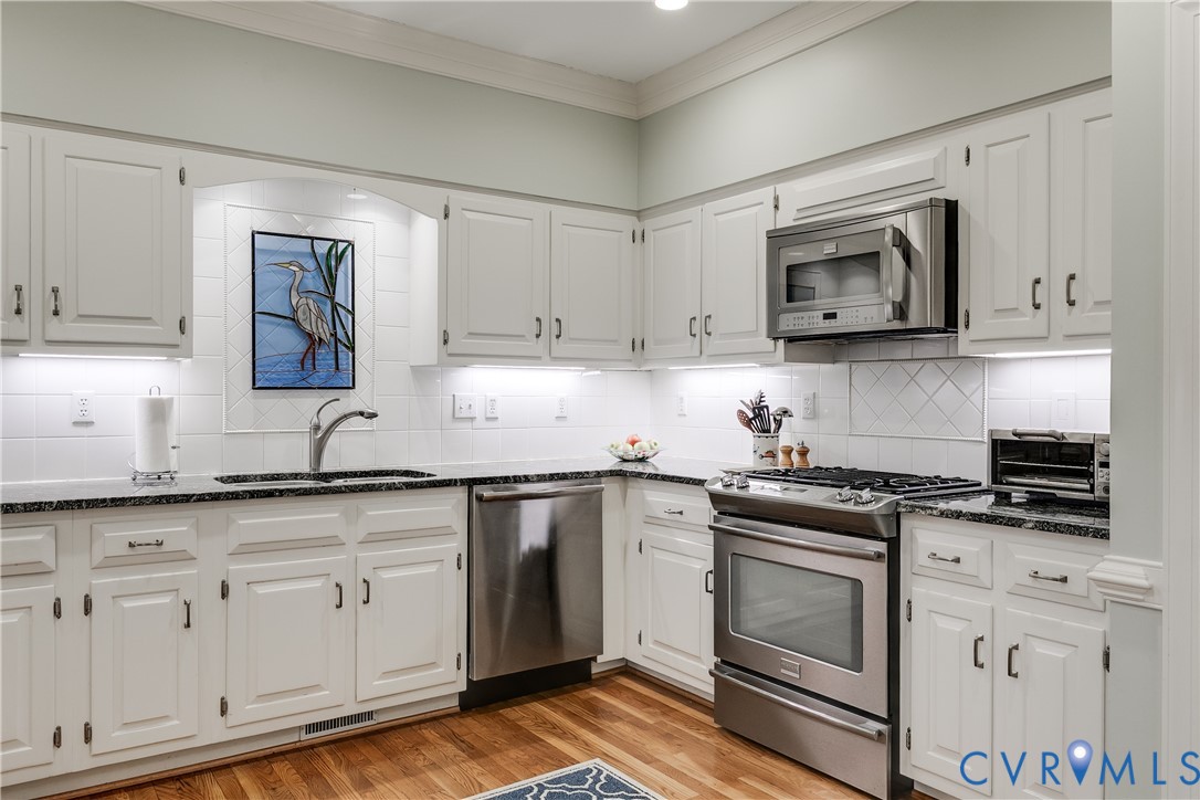 498 St Albans Way Henrico, VA 23229 - Photo 13 of 46 a kitchen with white cabinets and appliances